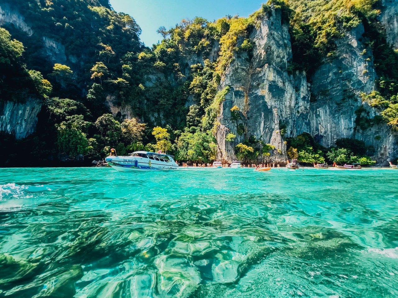 Scenic picture of Koh Phi Phi, crystal clear water and monkey beach in the distance